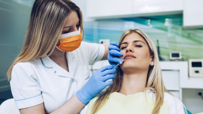 Young woman receiving a botox injection