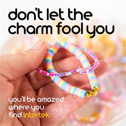 A hand holding a bracelet made from candy