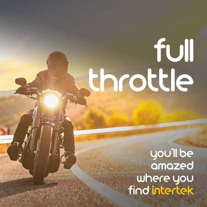 A motorcyclist riding on a rural road