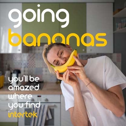 A woman fondly holding a banana next to her face