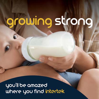 An infant being fed milk from a bottle
