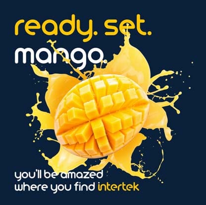 A mango sliced open with splashing mango juice behind it